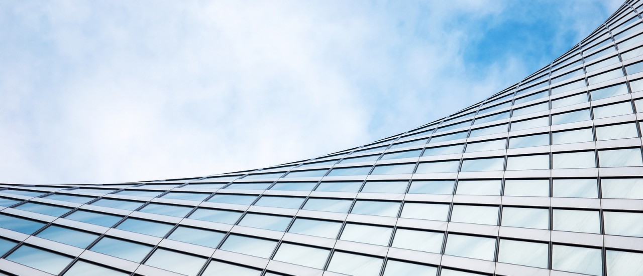 abstract modern architecture, glass exterior structure, wave shape building detail in blue sky - Moscow 19/07/2020